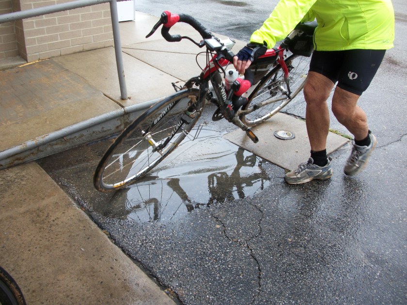 Trying to clean bike in a puddle