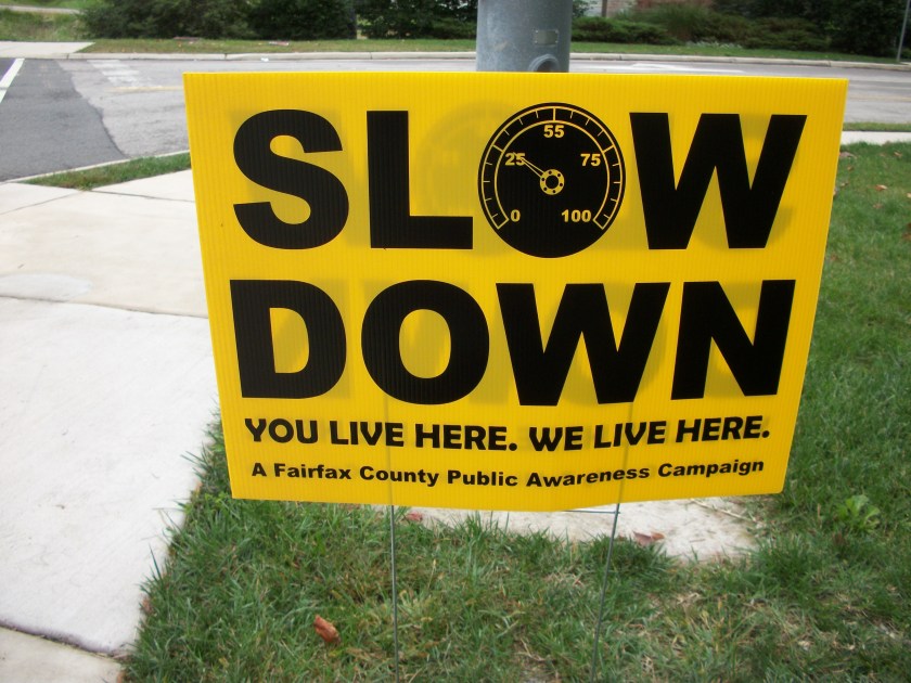 Sign says Slow Down. You live here. We live here.