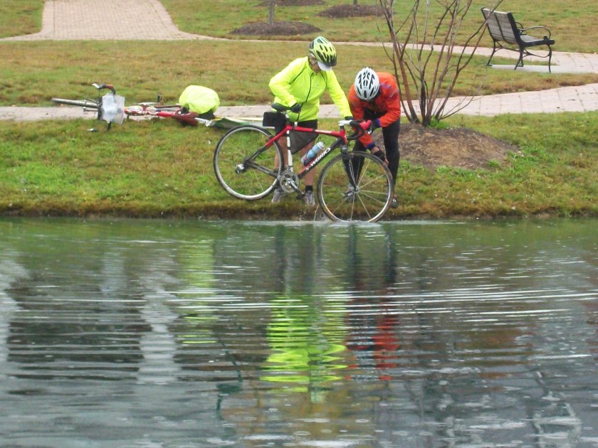 Washing bike in a ;pond
